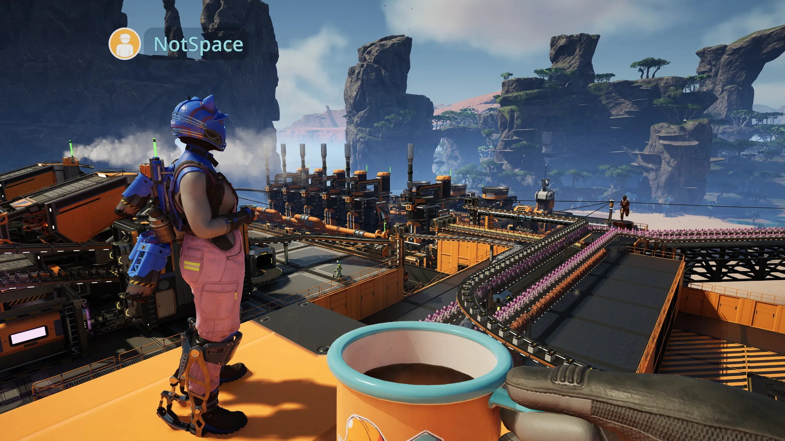 NotSpace and Biko drink coffee while watching the battery factory